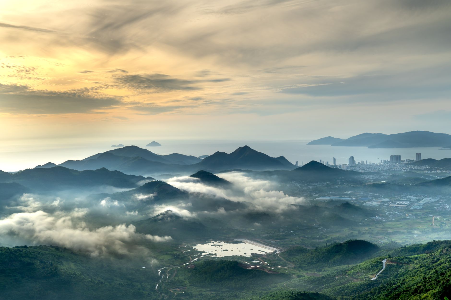 Breathtaking view of a misty mountain valley at sunrise, showcasing nature's beauty.