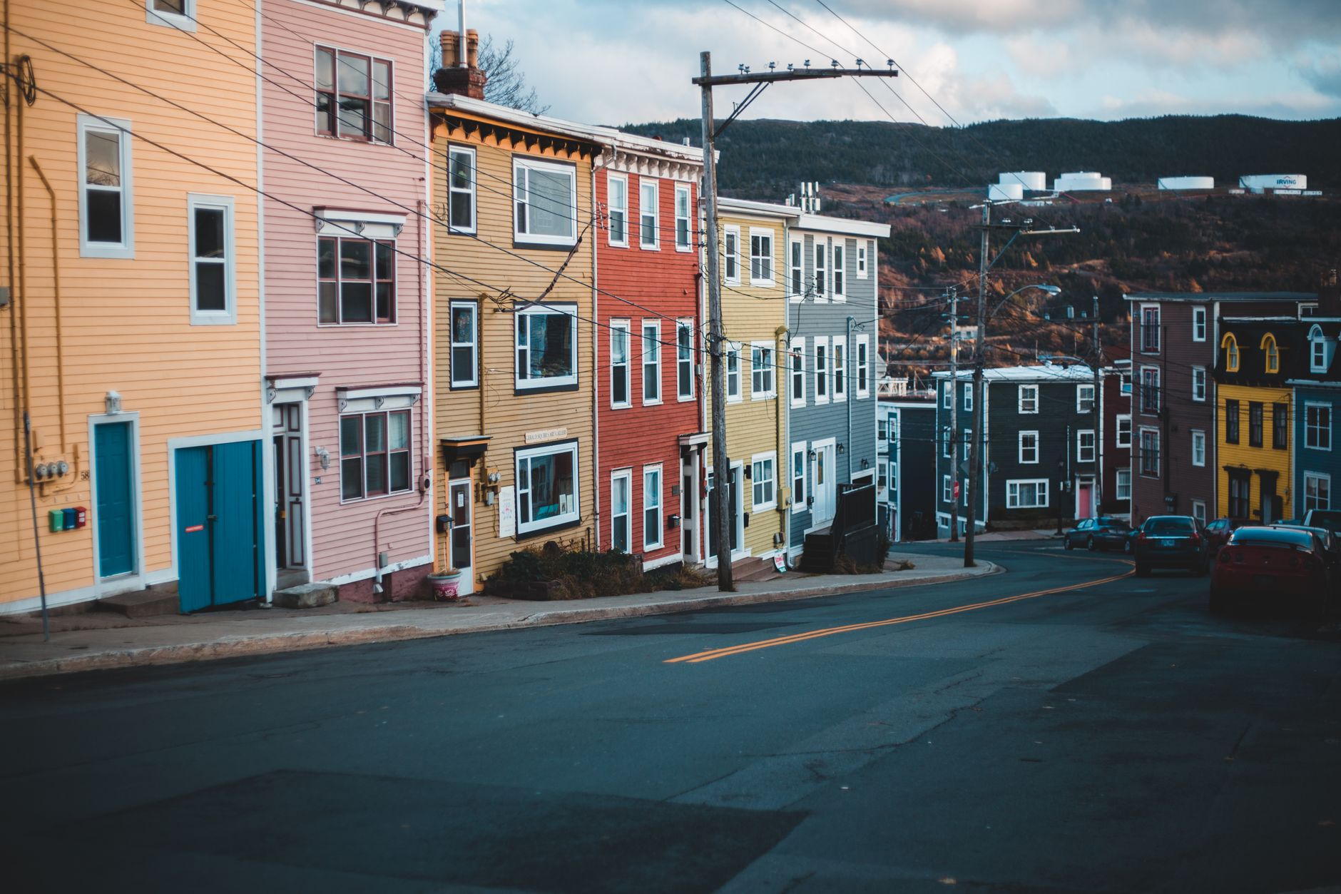 View of vibrant row houses on a quiet urban street, capturing the essence of city life.